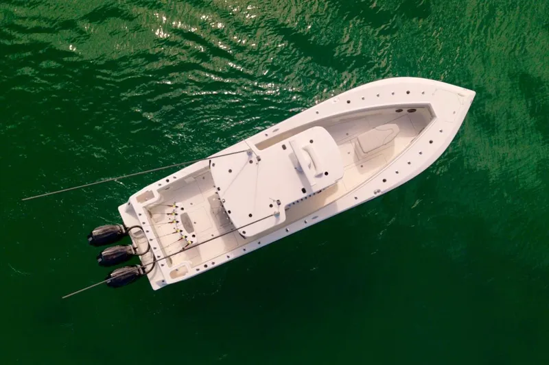  Yacht Photos Pics Aerial view of 2023 SeaVee 370Z boat on green water.