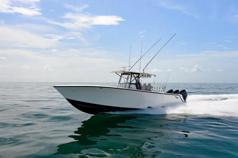  Yacht Photos Pics 2023 SeaVee 370Z boat cruising on open water under a clear sky.