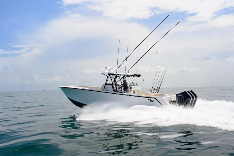  Yacht Photos Pics 2023 SeaVee 370Z boat cruising on open water under a clear sky.