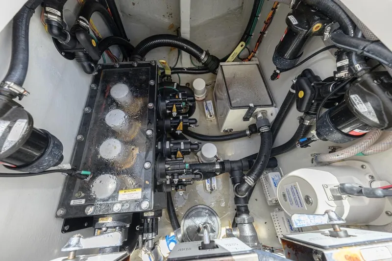  Yacht Photos Pics Engine compartment of 2023 SeaVee 370Z boat, showcasing complex mechanical systems and components.
