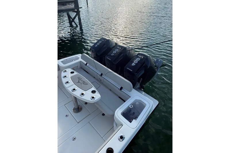  Yacht Photos Pics 2023 SeaVee 370Z boat with triple outboard engines on calm water.