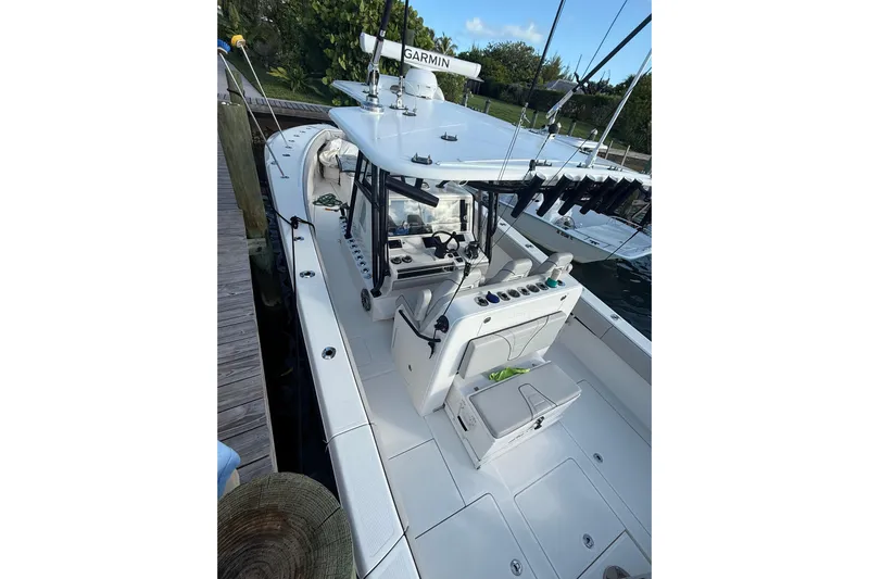  Yacht Photos Pics 2023 SeaVee 370Z boat docked, featuring a sleek design and advanced navigation equipment.