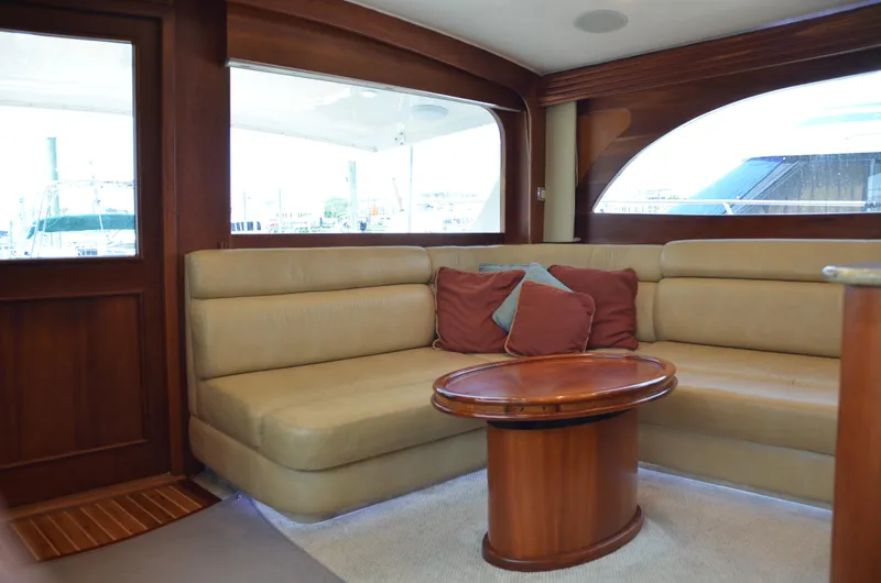 Cuda Yacht Photos Pics Luxurious interior of 2001 Buddy Davis 61 yacht with beige seating and wooden accents.
