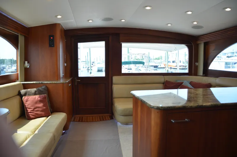 Cuda Yacht Photos Pics Luxurious interior of a 2001 Buddy Davis 61 yacht with elegant wood finishes.