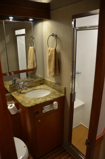 Cuda Yacht Photos Pics Luxurious bathroom in 2001 Buddy Davis 61 yacht with granite countertop and shower.