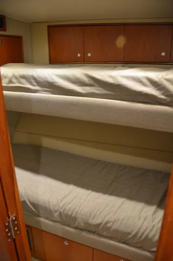 Cuda Yacht Photos Pics Bunk beds in 2001 Buddy Davis 61 yacht cabin with wooden cabinets.