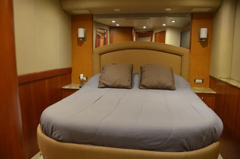 Cuda Yacht Photos Pics Luxurious bedroom interior of a 2001 Buddy Davis 61 yacht with elegant bedding.