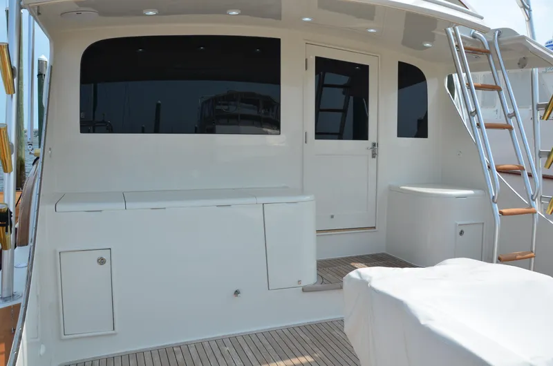 Cuda Yacht Photos Pics 2001 Buddy Davis 61 yacht deck with stairs and door, featuring sleek design and wood flooring.