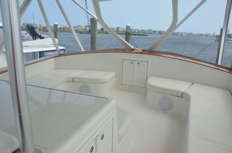 Cuda Yacht Photos Pics Spacious seating area on a 2001 Buddy Davis 61 yacht, overlooking a serene waterfront.