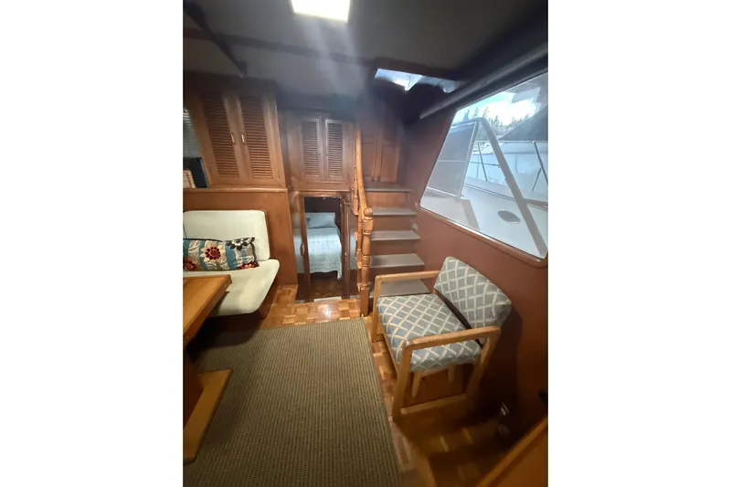 Island Time Yacht Photos Pics Interior of 1983 Ocean Alexander 43 Flush Aft Deck yacht with wooden furnishings.