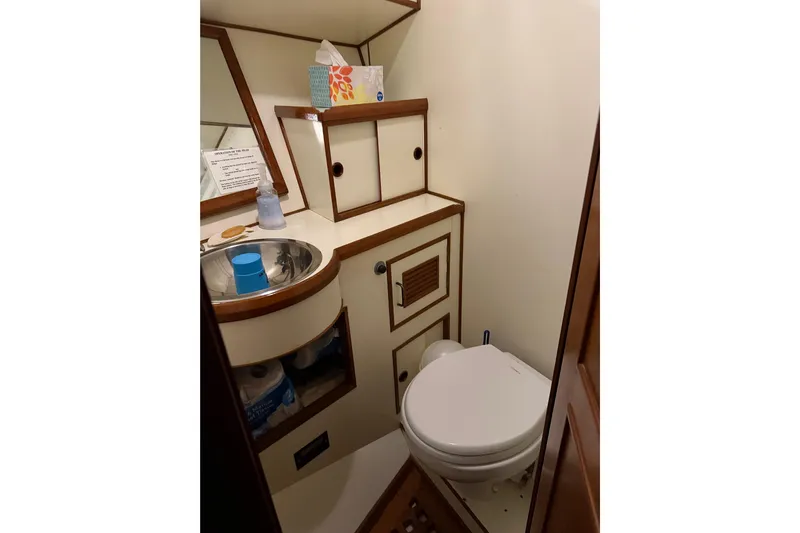 Island Time Yacht Photos Pics Bathroom interior of 1983 Ocean Alexander 43 Flush Aft Deck yacht.