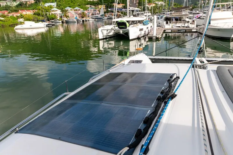 Miss Summer Yacht Photos Pics Lagoon 450 catamaran with solar panels docked in a marina, 2014 model.