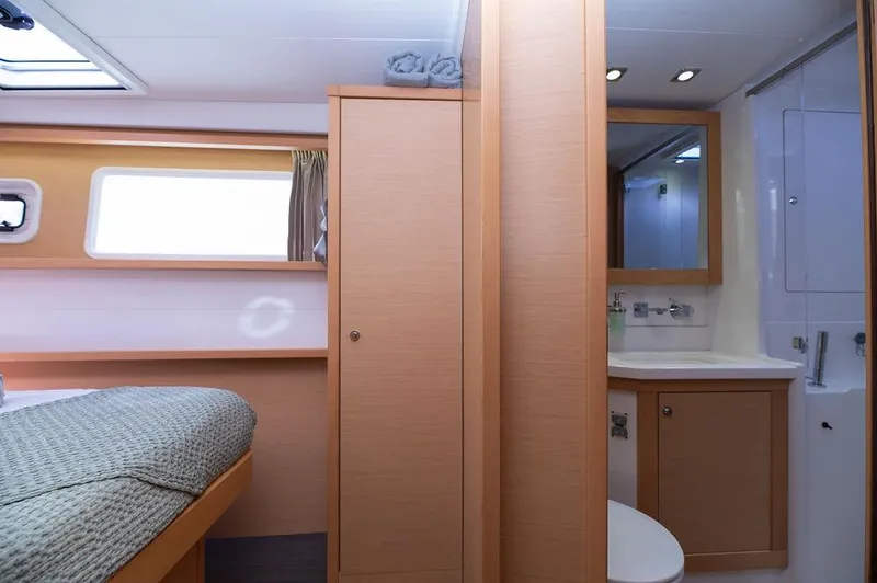 Miss Summer Yacht Photos Pics 2014 Lagoon 450 yacht interior with cozy cabin and modern bathroom amenities.