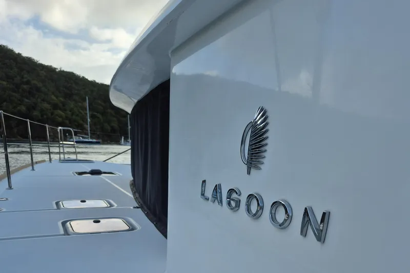 Miss Summer Yacht Photos Pics Lagoon 450 catamaran, 2014 model, docked with scenic background.