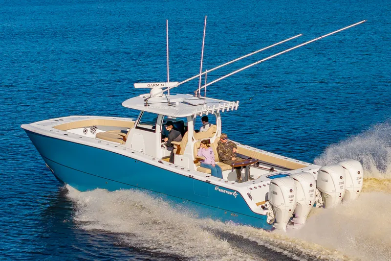 Krusty Krab II Yacht Photos Pics Freeman 38 boat 2025 on water with four outboard engines.