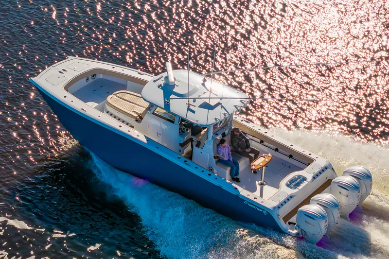 Krusty Krab II Yacht Photos Pics Freeman 38 boat 2025 on sunny water with four engines.