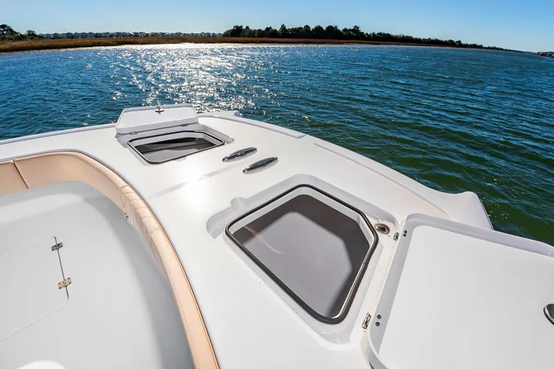 Krusty Krab II Yacht Photos Pics Freeman 38 boat 2025 on calm water with storage compartments.