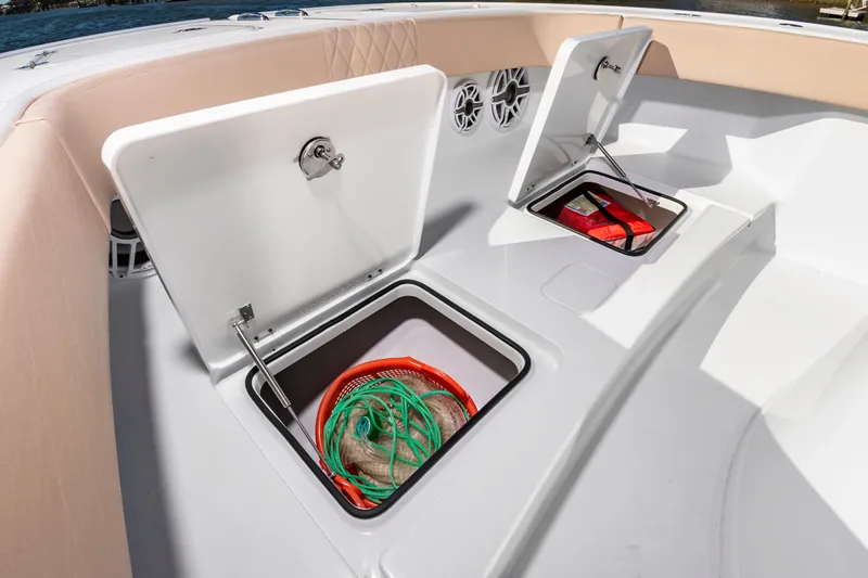 Krusty Krab II Yacht Photos Pics Freeman 38 boat 2025 with open storage compartments and gear.