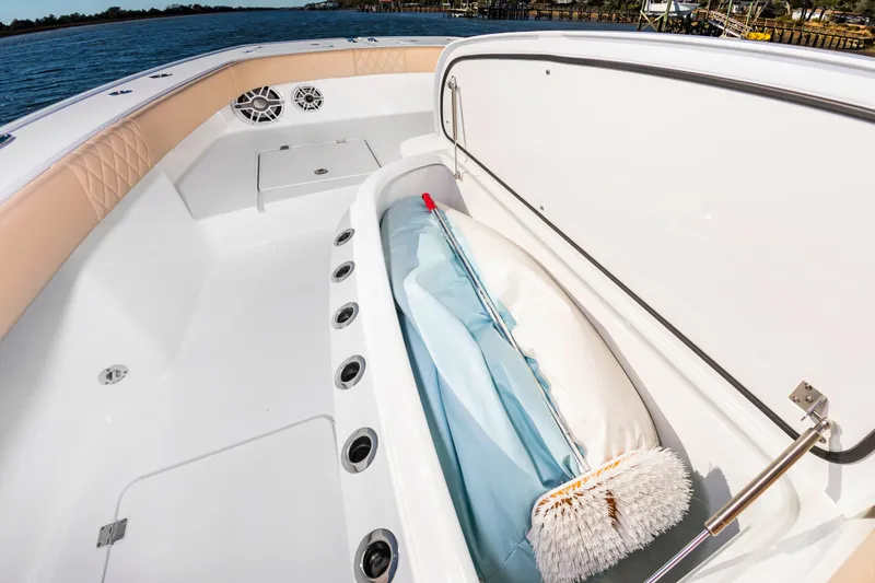 Krusty Krab II Yacht Photos Pics Freeman 38 boat 2025 with storage compartment and cleaning brush.