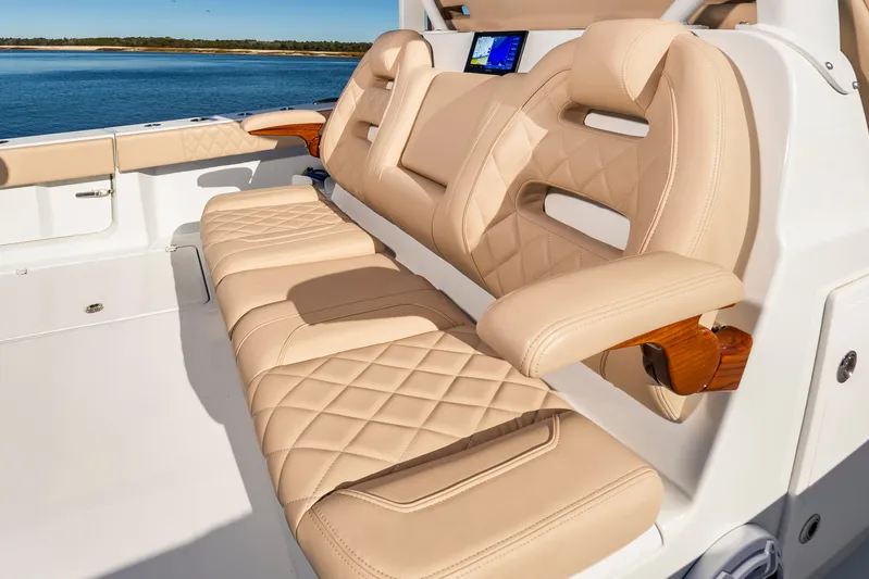 Krusty Krab II Yacht Photos Pics Luxurious seating on a 2025 Freeman 38 boat, beige leather upholstery.