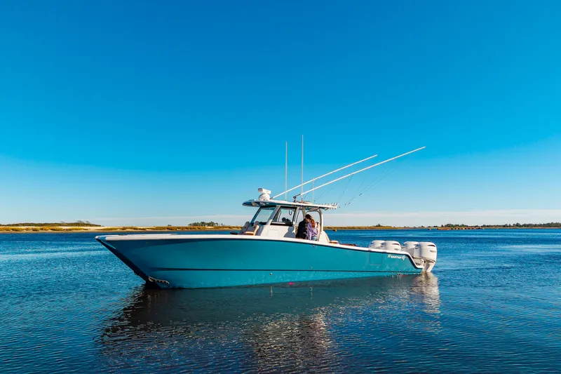 Krusty Krab II Yacht Photos Pics Freeman 38 boat 2025 on calm water under clear sky.