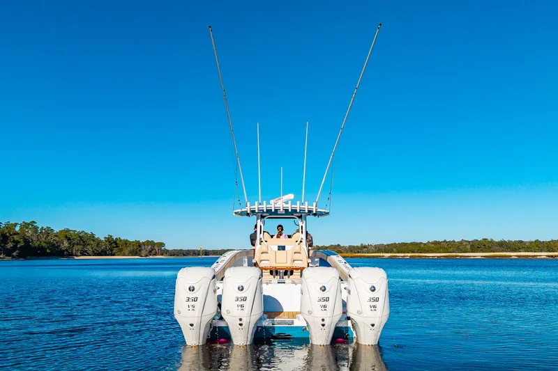 Krusty Krab II Yacht Photos Pics Freeman 38 boat 2025 with four outboard engines on calm water.