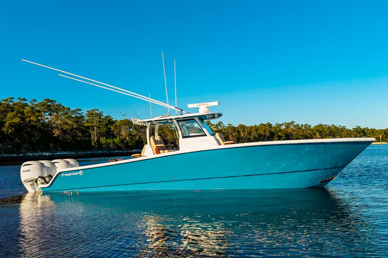 Krusty Krab II Yacht Photos Pics Freeman 38 boat 2025 on calm water under clear sky.