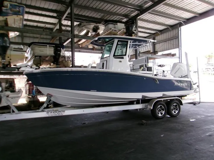  Yacht Photos Pics 2026 Blackfin 242 HB boat on trailer in covered storage area.