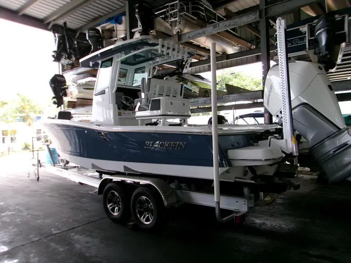  Yacht Photos Pics 2026 Blackfin 242 HB boat on trailer in storage facility.