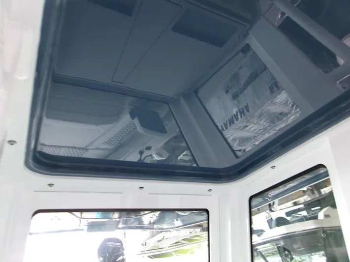  Yacht Photos Pics 2026 Blackfin 242 HB boat interior with glass ceiling and modern design elements.