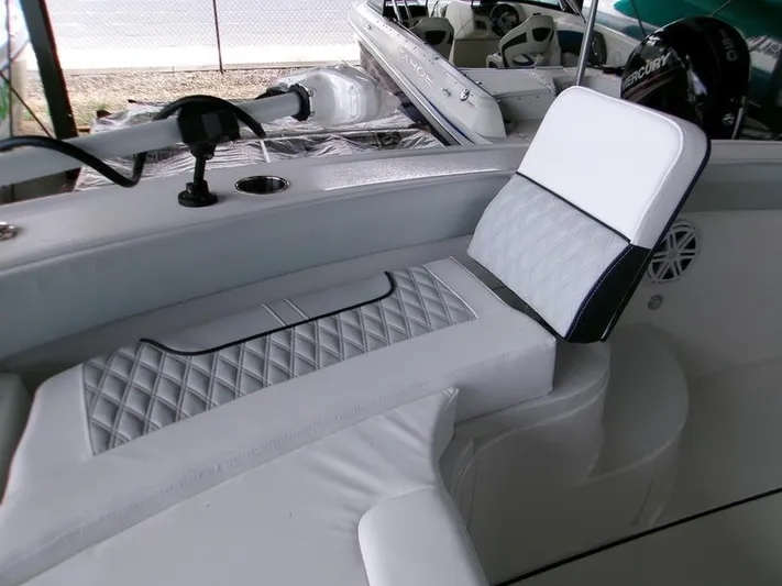  Yacht Photos Pics 2026 Blackfin 242 HB boat interior with white cushioned seating and modern design.