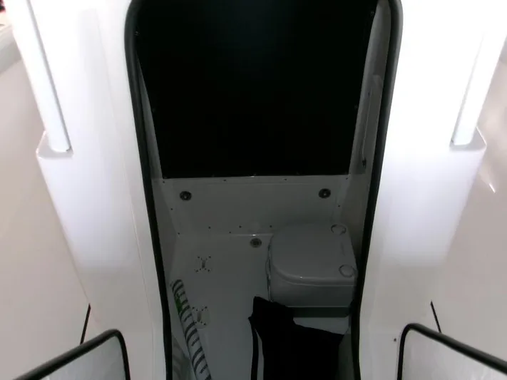  Yacht Photos Pics 2026 Blackfin 242 HB boat interior with compact marine toilet.