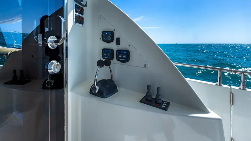 Next To Sell Yacht Photos Pics Control panel on a 2005 Marquis 59 yacht overlooking the ocean.