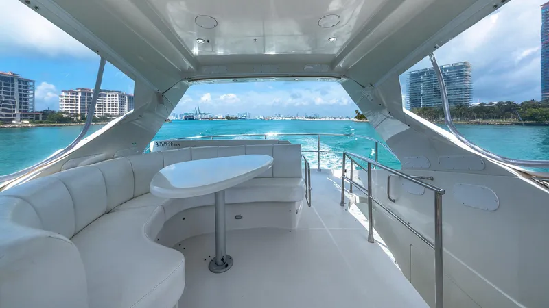 Next To Sell Yacht Photos Pics Luxurious 2005 Marquis 59 yacht interior with ocean view and modern seating.