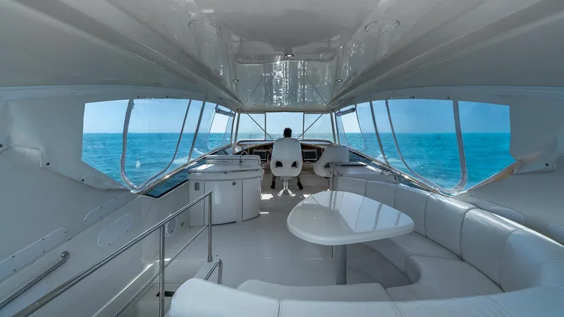 Next To Sell Yacht Photos Pics Luxurious 2005 Marquis 59 yacht interior with ocean view and modern seating.