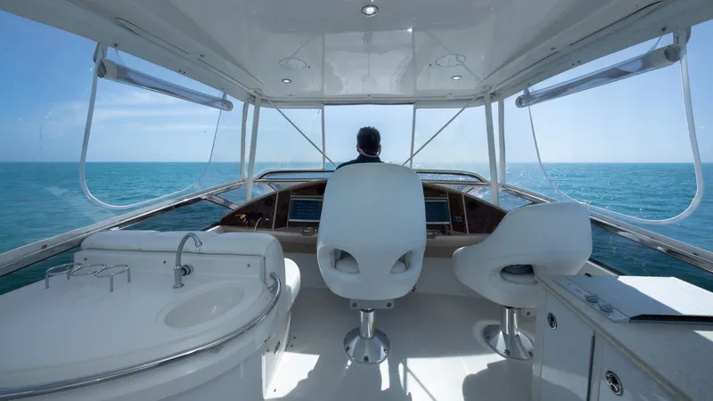 Next To Sell Yacht Photos Pics Interior view of 2005 Marquis 59 yacht helm, overlooking the ocean.