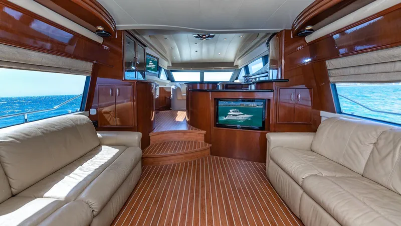 Next To Sell Yacht Photos Pics Luxurious 2005 Marquis 59 yacht interior with leather seating and ocean view.