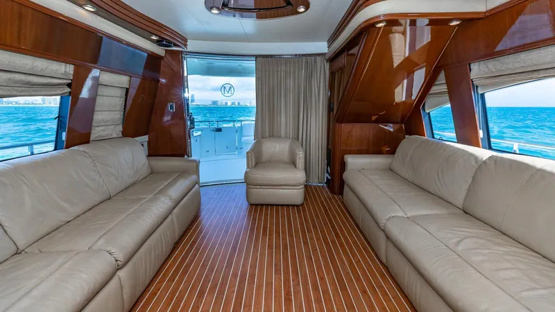 Next To Sell Yacht Photos Pics Luxurious interior of 2005 Marquis 59 yacht with leather seating and ocean view.