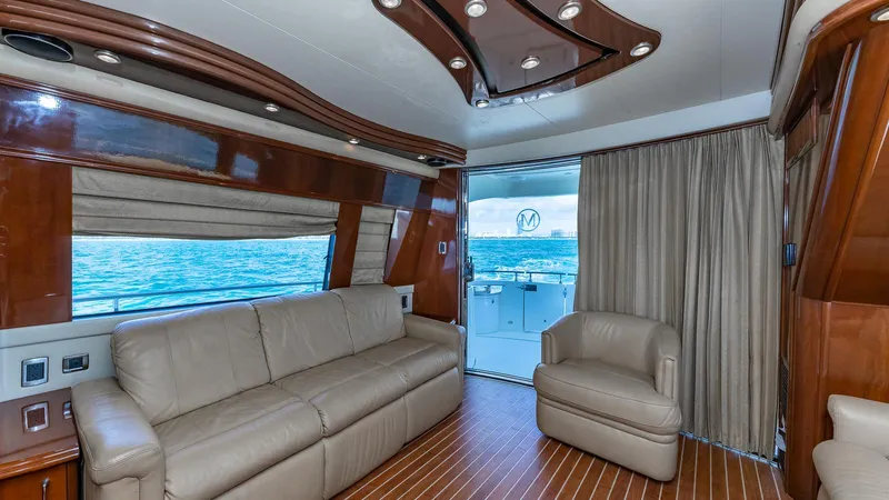 Next To Sell Yacht Photos Pics Luxurious interior of a 2005 Marquis 59 yacht with leather seating and ocean view.