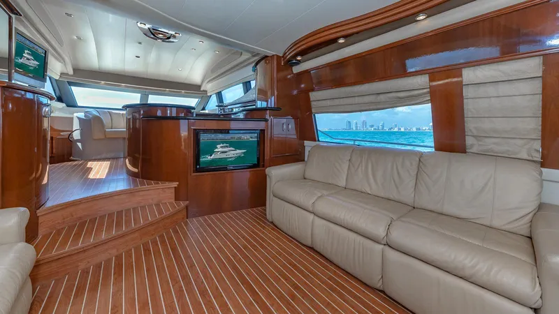 Next To Sell Yacht Photos Pics Luxurious 2005 Marquis 59 yacht interior with leather seating and wood finishes.