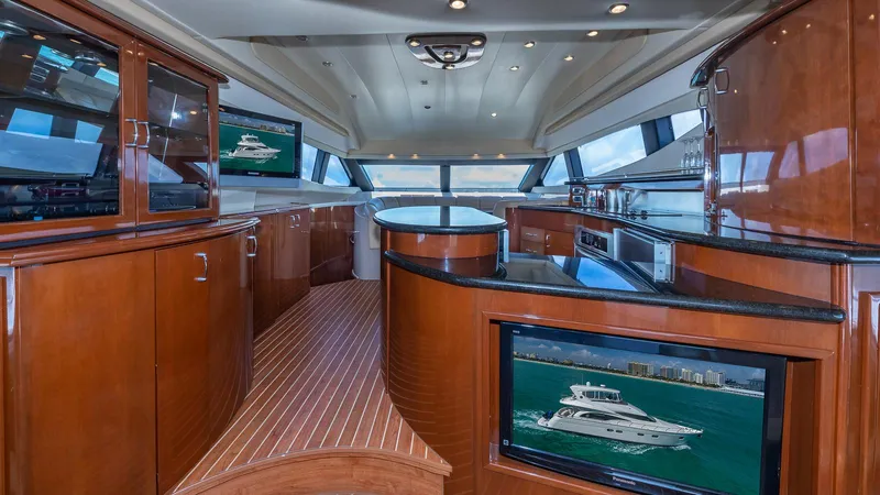 Next To Sell Yacht Photos Pics Luxurious interior of 2005 Marquis 59 yacht with polished wood and modern amenities.