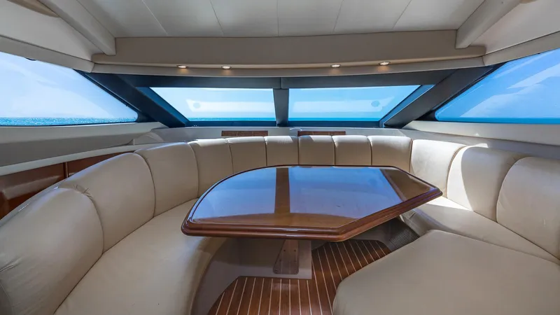 Next To Sell Yacht Photos Pics Luxurious interior of a 2005 Marquis 59 yacht with panoramic windows and plush seating.