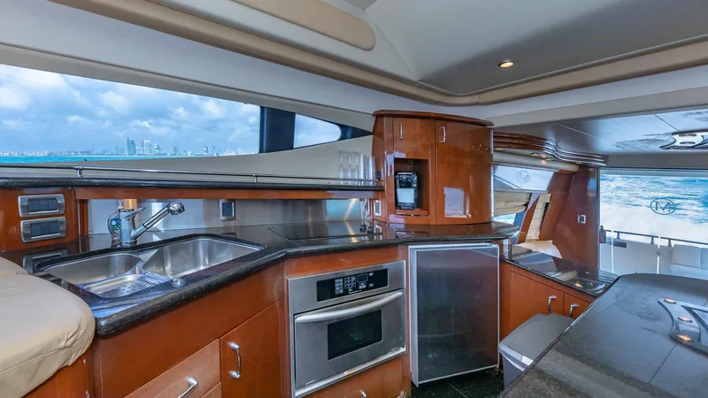 Next To Sell Yacht Photos Pics Luxurious 2005 Marquis 59 yacht kitchen with modern appliances and ocean view.