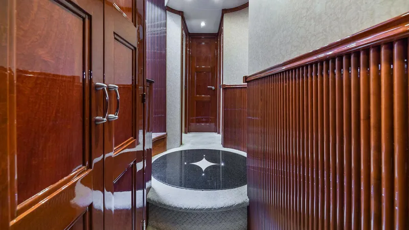 Next To Sell Yacht Photos Pics Luxurious wood-paneled hallway in a 2005 Marquis 59 yacht.