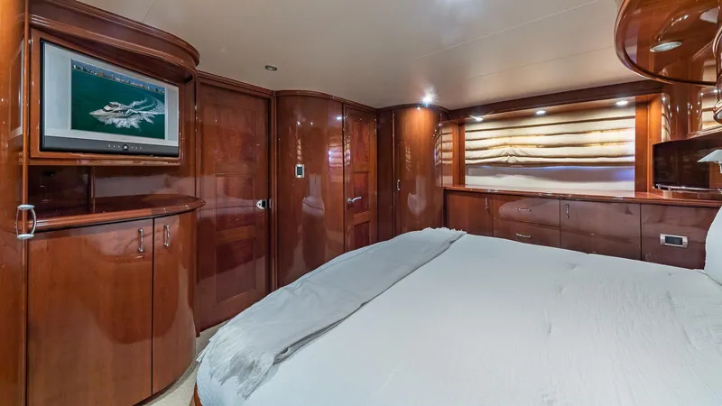 Next To Sell Yacht Photos Pics Luxurious 2005 Marquis 59 yacht bedroom with elegant wood paneling and modern amenities.