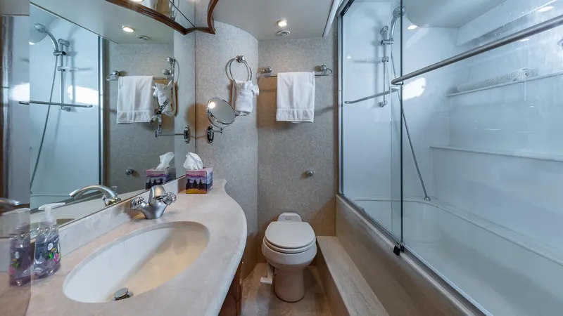 Next To Sell Yacht Photos Pics Luxurious 2005 Marquis 59 yacht bathroom with modern fixtures and glass shower.