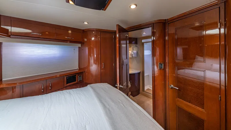 Next To Sell Yacht Photos Pics Luxurious 2005 Marquis 59 yacht interior with polished wood and modern amenities.