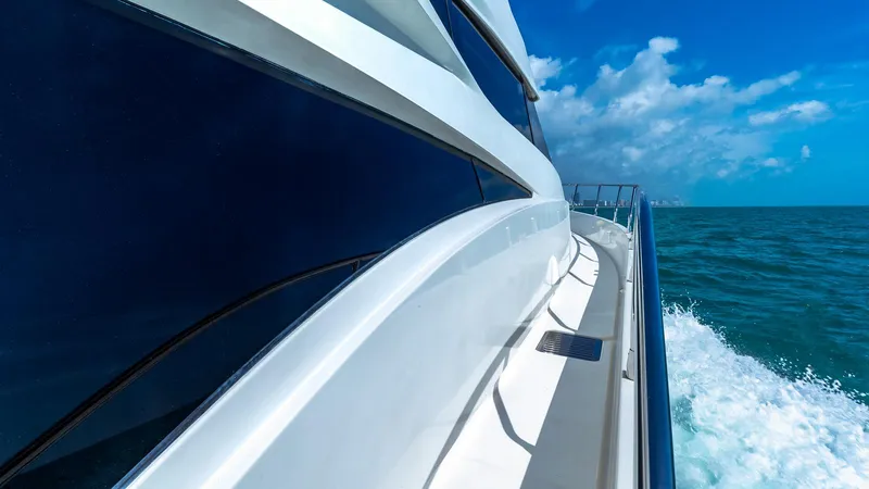 Next To Sell Yacht Photos Pics Side view of a 2005 Marquis 59 yacht cruising on the ocean.