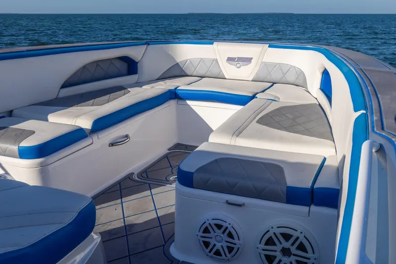 Loan Shark II Yacht Photos Pics Luxurious seating on 2019 Deep Impact 399 Sport boat with ocean backdrop.