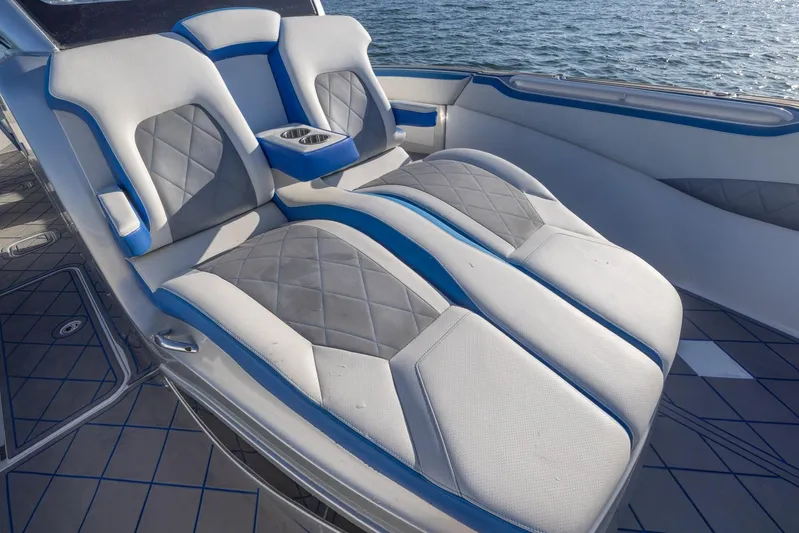 Loan Shark II Yacht Photos Pics Luxurious seating on 2019 Deep Impact 399 Sport boat with blue and gray upholstery.
